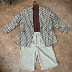 Checked Blazer with Brown Knit Top and beige and white Pinstripe Trousers